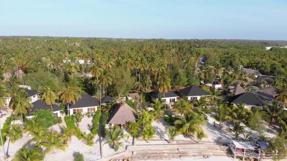 Paradise Coast Resort with Palm Trees and Hotels By Ocean Zanzibar Aerial View alt
