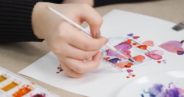 Process of Painting Card with Hearts for Valentine's Day Closeup