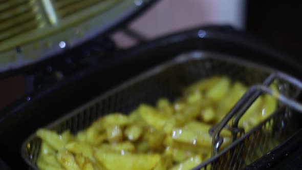 Cook Prepares Fries