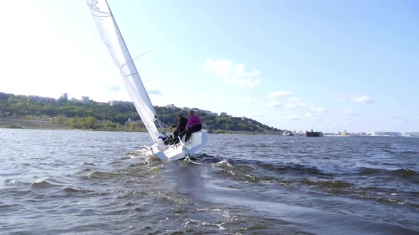 Dangerous Maneuver on a Sailing Yacht, the Boat Tilted During the Turn with Slowmotion Effect. alt