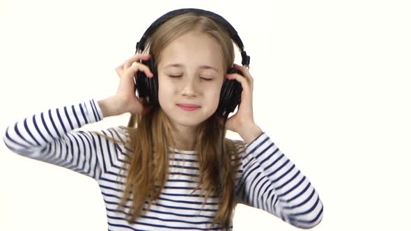 Teenager Girl Listens Music on Headphones and Dances, Close Ups alt