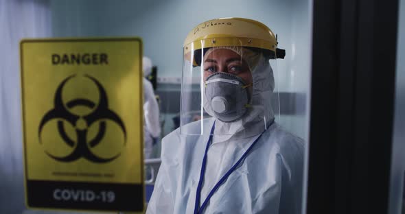 Medical Practitioner Looking at Camera in COVID Ward alt