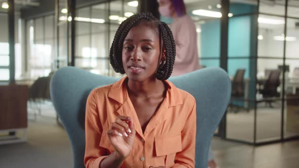 Sitting in the Entrance Hall in the University a Young African Professor is Talking About the alt