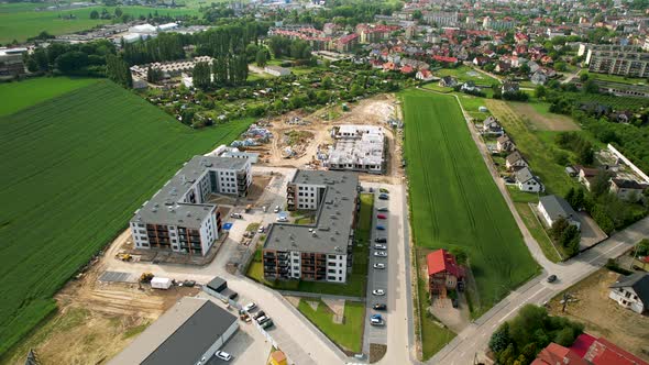 Construction Site With Green Fields Near The Community. - aerial alt