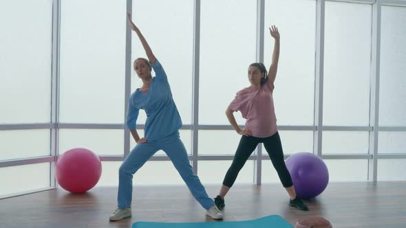 A Pregnant Woman Is Doing Physical Exercises For Pregnant Women alt