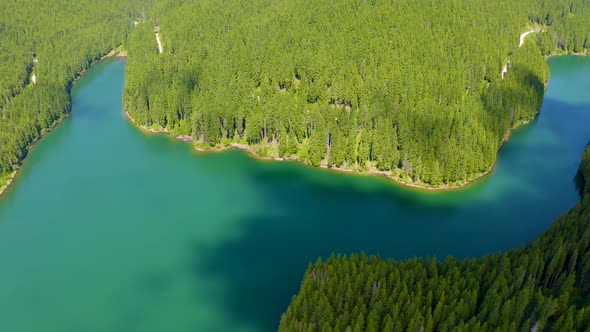 Mountain lake with turquoise water and green trees, Reflection in the water, Baikal Lake alt