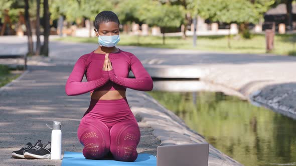Black Instructor Holding Online Lessons Shows Breath Technique to Reach Inner Harmony Stress Relieve alt