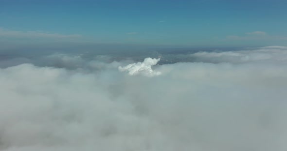 Aerial View. Scenic Aerial View Through Moving White Clouds. Fog. alt