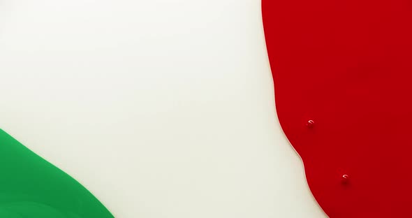 Red and green colored ink moving towards the center, Italy flag liquid colors concept alt