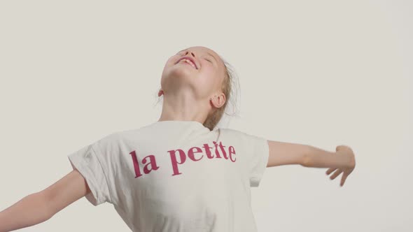 Young Girl in Studio Making Faces and Have Fun