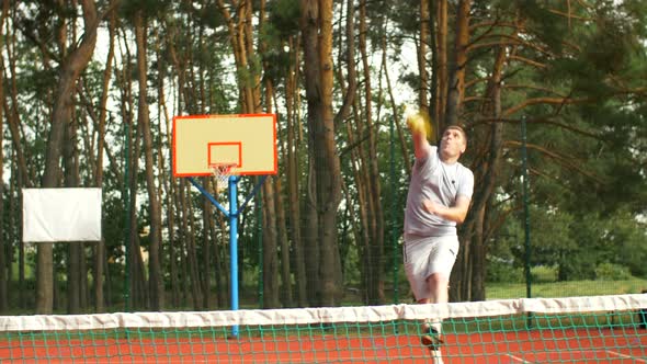 Focused Tennis Player Hitting Smash Near the Net alt