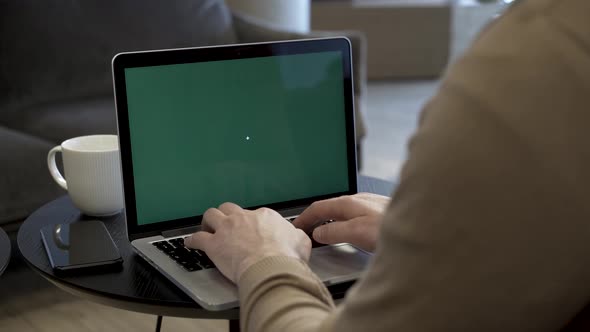 Freelancer Working With Green Screen Laptop