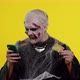 Sinister Man Halloween Zombie Using Credit Bank Card and Smartphone While Purchases Online Shopping - VideoHive Item for Sale