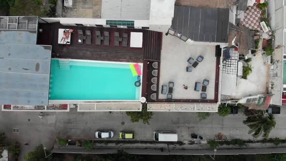 Aerial Flight View of Rooftop Swimming Pool and Fly a Drone