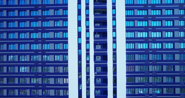 A blue building with windows alt