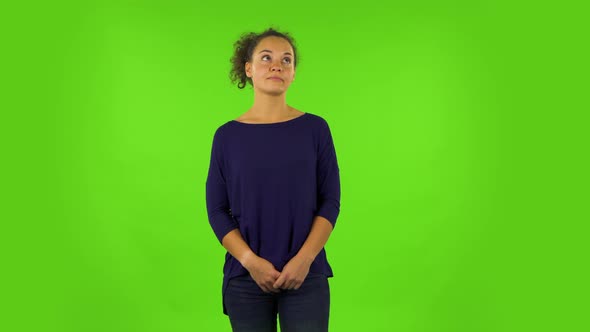 Curly Woman Listening Carefully To Boring Information. Green Screen alt