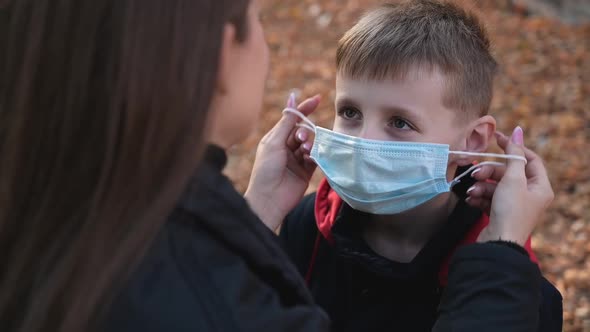 Mom Takes Off the Medical Mask From Her Son's Face