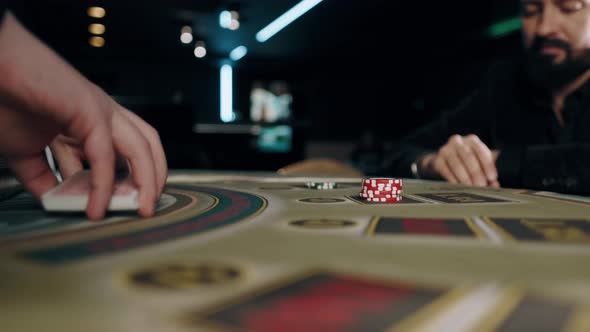 People Playing Poker in Casino alt