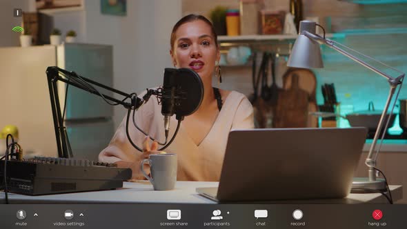 Famous Vlogger Waving at Camera From Home Studio alt