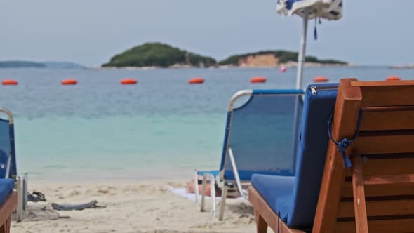 Empty Sun Loungers on the Sandy Beach Against the Turquoise Sea Albania Ksamil alt