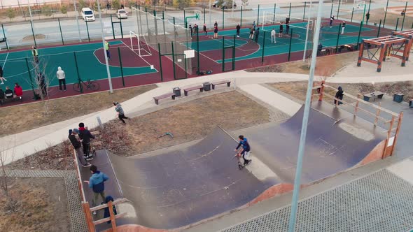 Teenagers Spend Free Leisure Time on the Territory of the Sports Ground alt