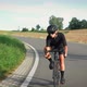 Woman cycling on road bike downhill - VideoHive Item for Sale