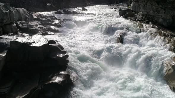 Slow Motion Drone Flying Up White River Rapids For Crisp Detail Nature Shot alt