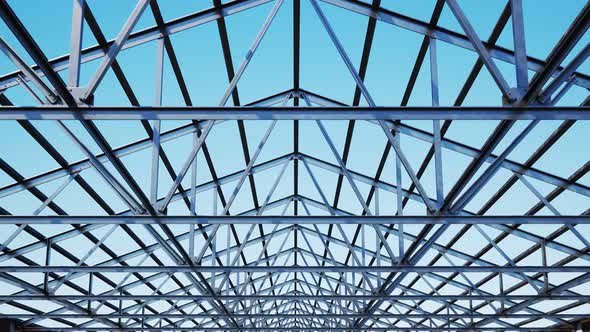 Seamless looping shot with camera moving along the unfinished steel roof alt