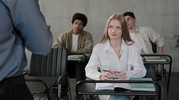 Diverse Team Young People Sitting in Classroom Attentively Listening Lecture Group Leader Explaining alt
