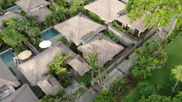 Flight of a Drone Over a Village on the Seashore alt