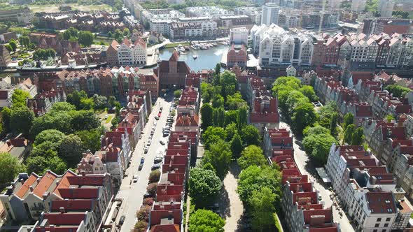 Aerial view of Gdansk old town in summer scenery in the afternoon, Poland top-down view, side motion alt