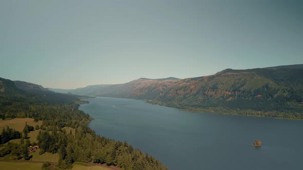 Bird'seye View of the Sunrise Over the River with Hilly Terrain alt