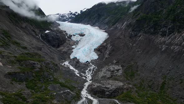 Bear Glacier winding down through the mountains into Strohn Lake in Bear Glacier Provincial Park, Br alt