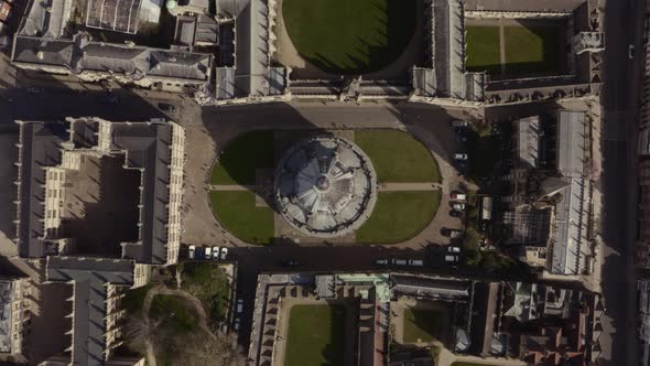 Top down rising drone shot over Bodleian Library Radcliffe camera Dome Oxford alt