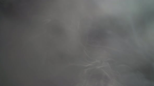 Smoke From Top on Black Background alt