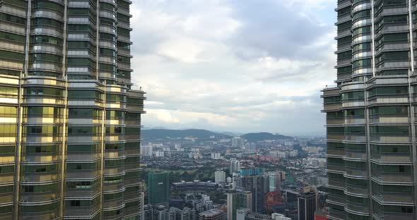 Aerial View on the Downtown, Kaula Lumpur, Malaysia, Drone Goes Between Petronas Twin Towers, Sunset alt
