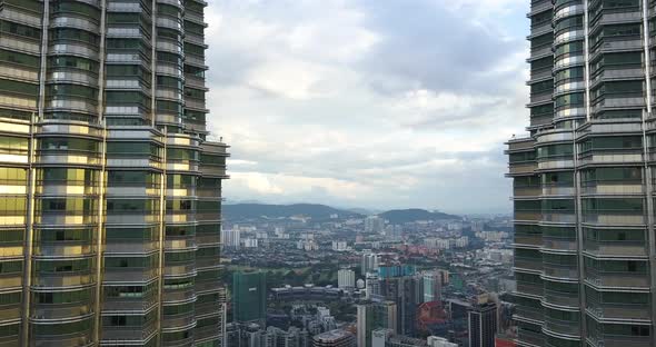 Aerial View on the Downtown, Kaula Lumpur, Malaysia, Drone Goes Between Petronas Twin Towers, Sunset