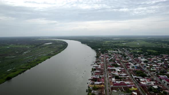 backwards drone shot of the city of Tlacotalpan in veracruz, a world heritage site alt