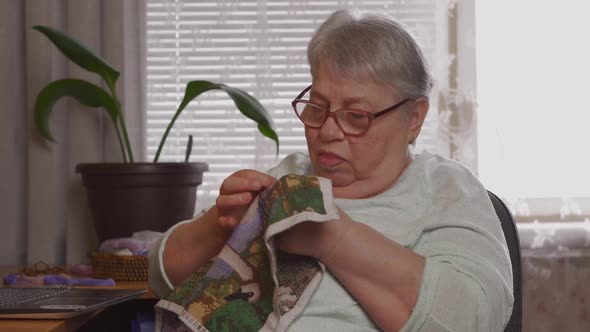Tired Elderly Woman Embroiders Taking Off Eyeglasses Feeling Eye Strain Concept