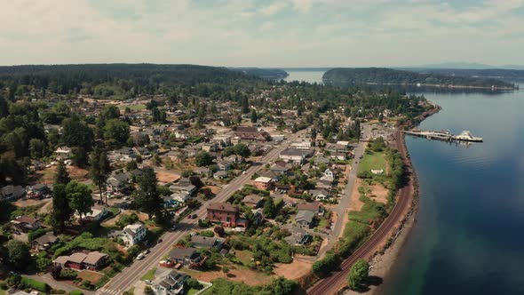 Train Travels Along the Puget Sound Wtaerfront in Steilacoom Washington Ferry Docked