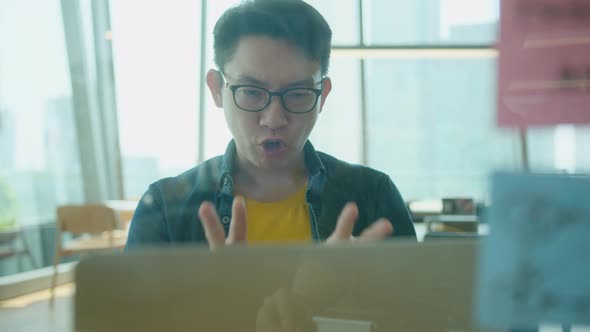 Smart positive smile asian male businessman video conference remote working alt