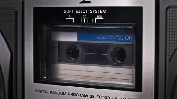 Audio Cassette Tape Rotates in Deck of an Old Tape Recorder alt