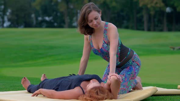 Arm Thai Massaging on the Lawn alt