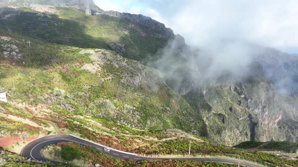 Madeira Mountains Epic High Cliffs in the Clouds Aerial Drone Footage with an Helicopter View of alt