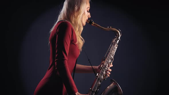 Woman Plays On Saxophone Jazz Melody
