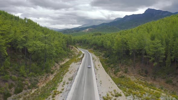 The Car Is Driving on the Mountain Road with Green Forest in Manavgat Antalya Turkey alt