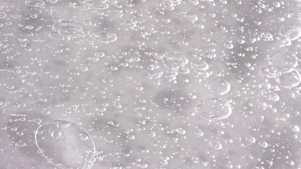 Macro Shot of Air Bubbles in Transparent Cosmetic Liquid Gel Cream alt