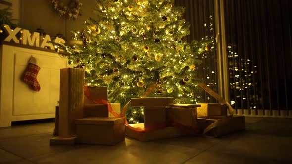 Illuminated Christmas Tree With Presents at Home alt