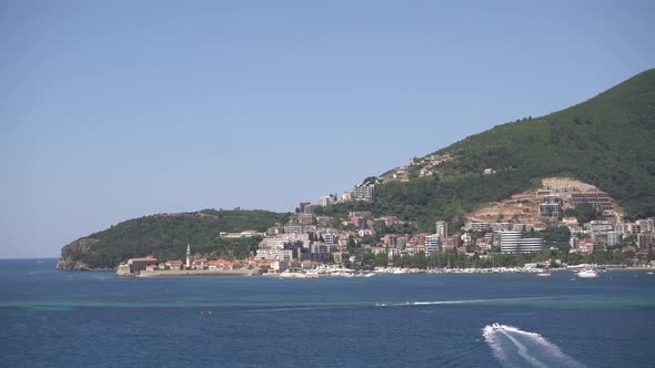 Boats in an Accelerated Mode Sail on the Sea Off the Coast of Budva alt