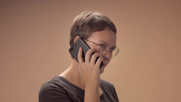 Caucasian Woman in Studio Talking on the Mobile Phone
